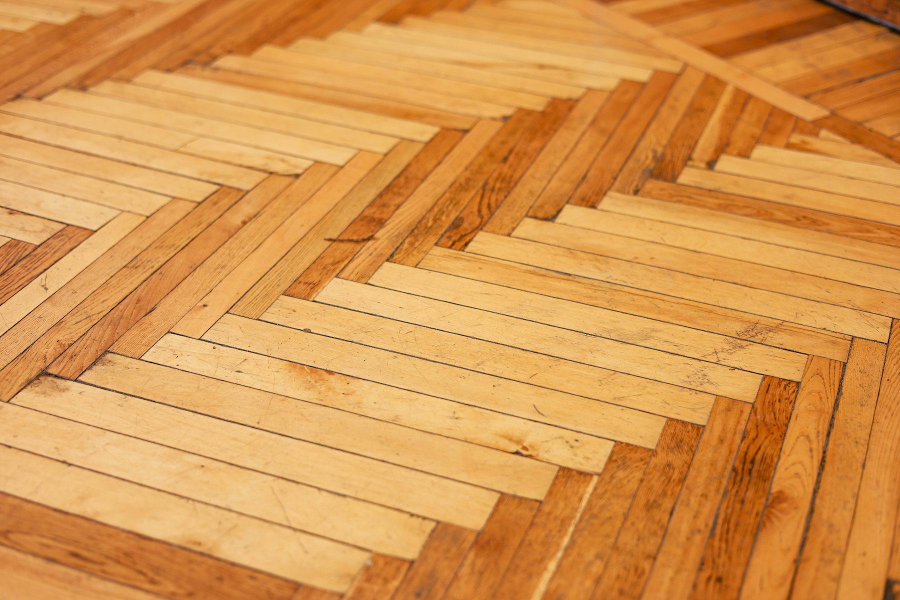 Warm wood-pattern flooring installed in a refined interior